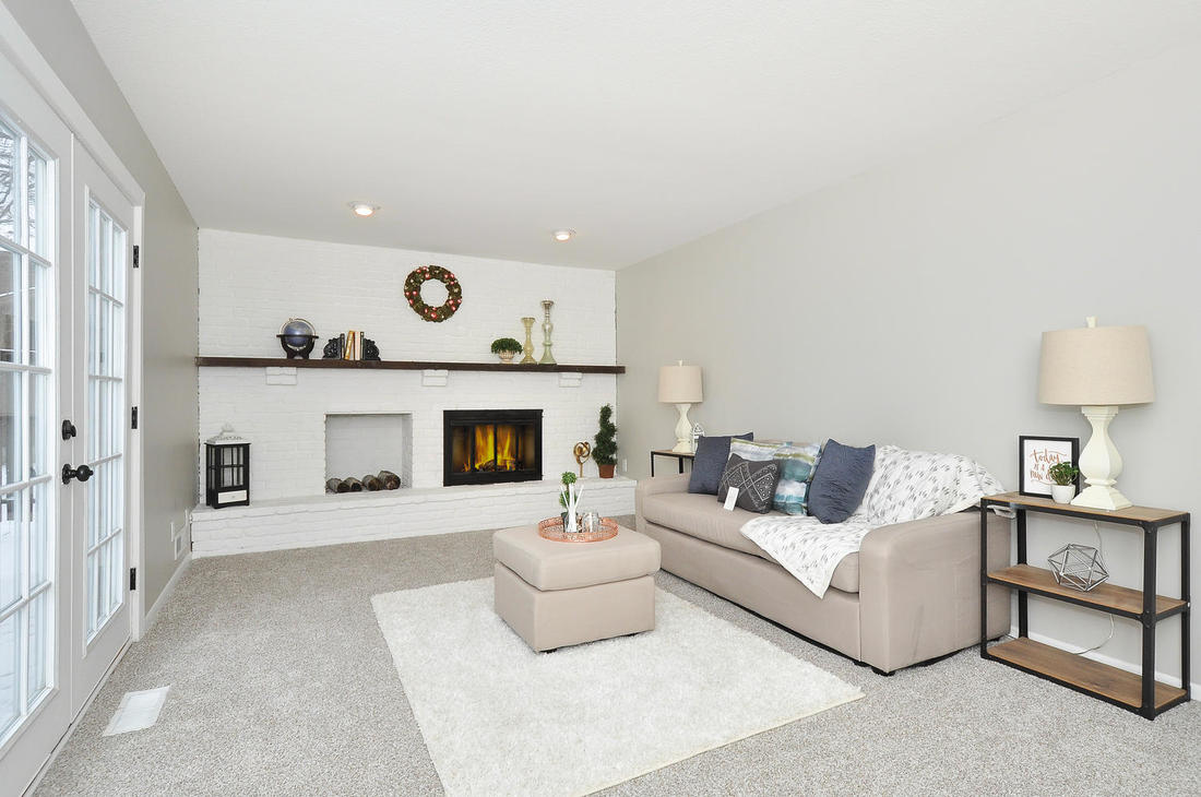 Completed Dayton renovation with a bright sitting room and fireplace